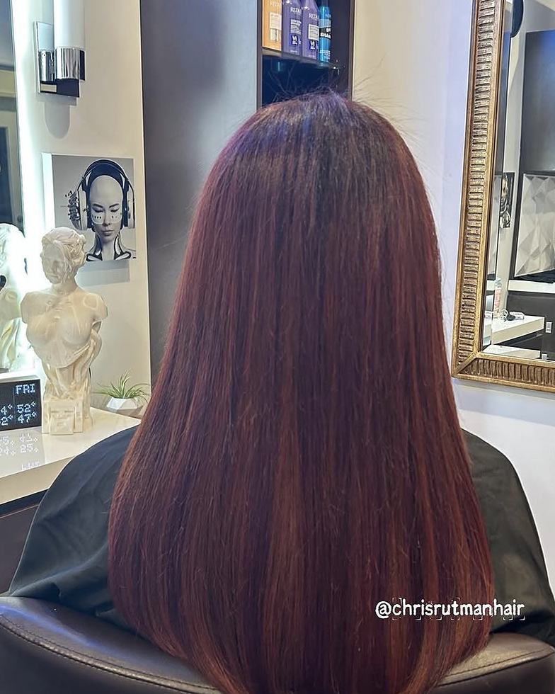After keratin-tip hair extensions: corrected, smooth, full auburn hair below the shoulders