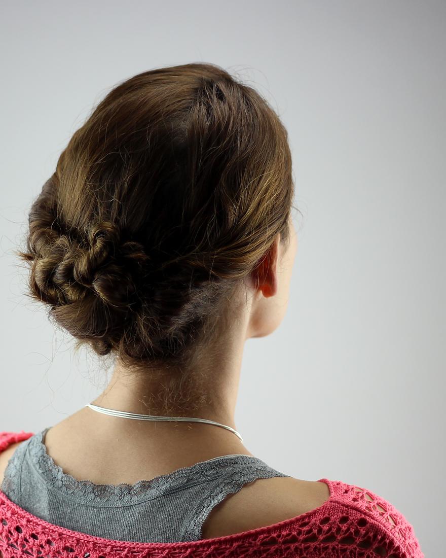 Twisted low chignon on brunette hair