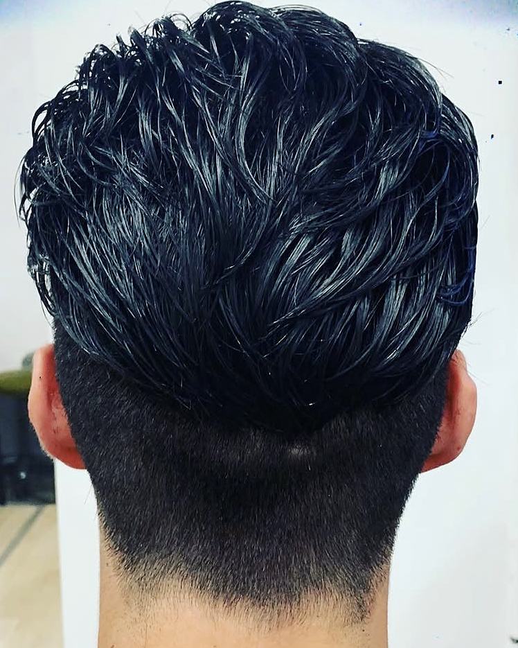 Men's textured cut with a tapered nape