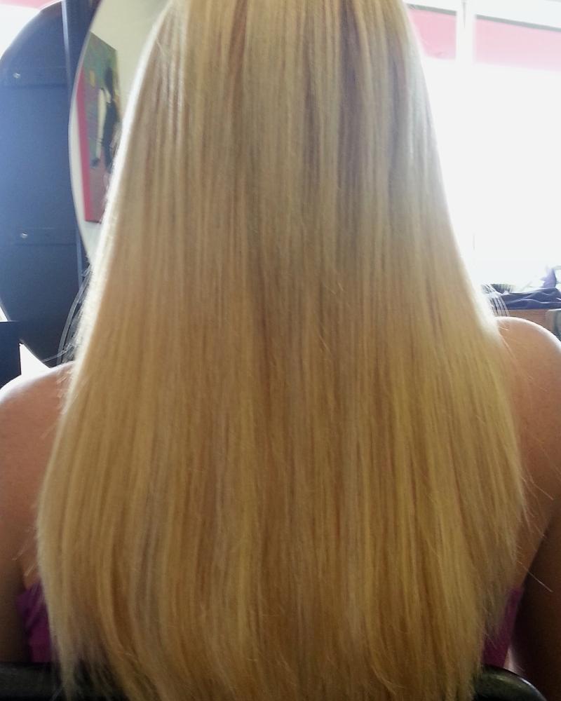 After keratin-tip hair extensions: long, smooth blonde hair to mid-back, the same day