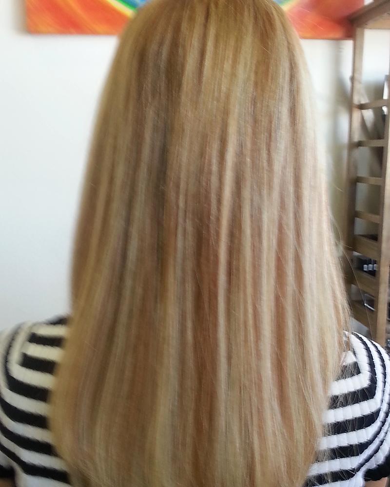 After keratin-tip hair extensions: full, blended blonde length with thicker ends, the same day