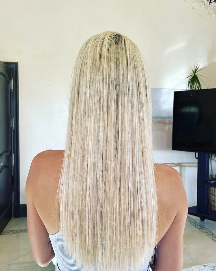 After keratin-tip hair extensions: sixteen inches of long, sleek mixed platinum-blonde hair to mid-back