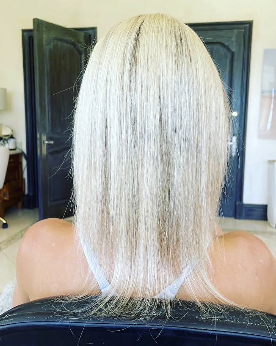 Before keratin-tip hair extensions: shoulder-length platinum-blonde hair