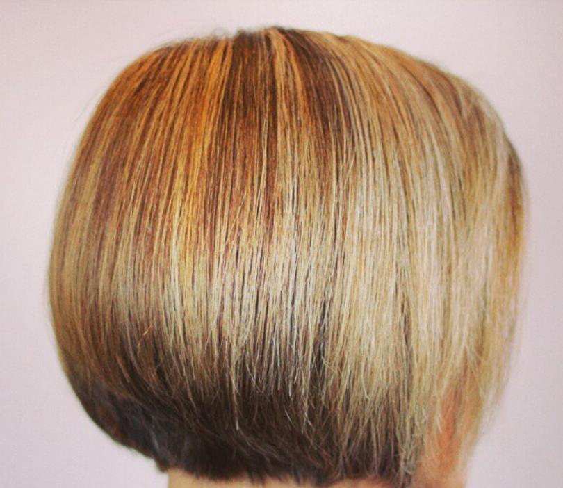 Back view of a sharp, graduated bob with blended highlights